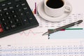 Financial documents of the company with figures and money. Cup of coffee, a calculator and a pen on the Manager`s Desk. Analysis Royalty Free Stock Photo