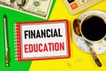 Financial education-text label in the planning notebook. The study of Knowledge that ensures the well-being of business.