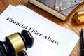 Financial Elder Abuse report and gavel. Royalty Free Stock Photo