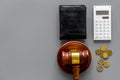 Financial failure, bankruptcy concept. Judge gavel, wallet, coins, calculator on grey background top view copy space