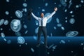 Financial freedom, success, investing and cryptocurrency concept with businessman on dark blue background under bitcoin rain