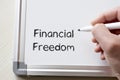 Financial freedom written on whiteboard