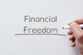 Financial freedom written on whiteboard