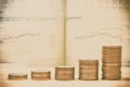 Financial growth concept with stacks of coins in yellow color and vintage filter