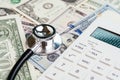 Financial health check, tax or medical and health care expense concept, stethoscope put on FED federal reserve emblem on US dollar