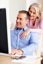 Financial, hug or mature couple with computer in home for retirement savings or pension budget. Planning, finance news