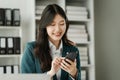 Financial institution worker female asian people, professionals engrossed in tasks. Business people diligently crunching numbers,