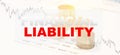 FINANCIAL LIABILITY - financial word on table with graph, chart and money Royalty Free Stock Photo