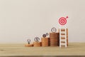 Financial management/goals asset investment concept: Arrange business plan icon on rows of rising coins, Demonstrating excellent Royalty Free Stock Photo