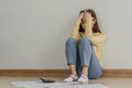 Financial owe asian woman, female sitting on floor home, stressed and confused by calculate expense from invoice or bill, have no Royalty Free Stock Photo