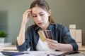 Financial owe, hand of asian woman sitting, holding many credit card, stressed by calculate expense from invoice or bill, no