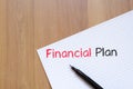 Financial plan text concept on notebook Royalty Free Stock Photo