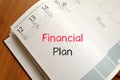 Financial plan text concept on notebook Royalty Free Stock Photo