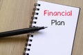 Financial plan text concept on notebook Royalty Free Stock Photo