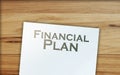 financial plan words on page and paper signs of dollar around. Business concept