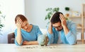 Financial planning bankrupt family couple in stress with piggy Bank