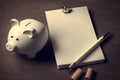 Financial planning. A piggy bank and a notebook. A minimalistic conceptual illustration Royalty Free Stock Photo