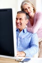 Financial, planning or senior couple with computer in home for retirement savings or pension budget. Hug, finance news