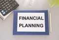 FINANCIAL PLANNING text written on white paper above on Notebook. business concept,Top view flat lay Royalty Free Stock Photo