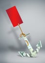 Financial problems concept, anchor made of money with blank label Royalty Free Stock Photo