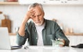 Financial Problems. Depressed Senior Man Looking At Cash Money In Hand Royalty Free Stock Photo