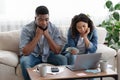 Financial Problems. Upset Black Couple Managing Family Budget Together At Home Royalty Free Stock Photo