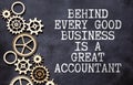 Financial quote Behind Every Good Business Is A Great Accountant handwritten on yellow sticky note on laptop keyboard