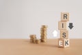 Financial risk assess management and business analysis concept. RISK text on stack of wooden cube blocks with flipping cube