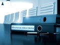 Financial Solutions on Folder. Blurred Image.