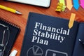 Financial Stability Plan FSP with charts and pen.