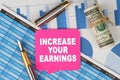 Among the financial statements and charts is a note with the text - INCREASE YOUR EARNINGS