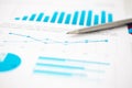 Financial statistics documents ball pen infographics at office table Royalty Free Stock Photo