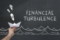 Financial turbulence concept on blackboard