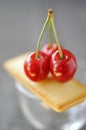 Financier and cherries on a glass cup
