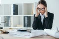 financier working at table in office