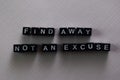 Find away not an excuse on wooden blocks. Motivation and inspiration concept