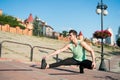 Find balance. Man workout outdoors urban background. You should stretch muscles after workout to achieve best result