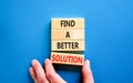 Find a better solution symbol. Concept words Find a better solution on wooden blocks. Beautiful blue table blue background.