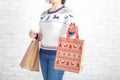 Find idea for gift, shopping bag in female hand