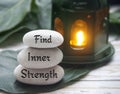 Find inner strength words engraved on zen stones. Motivational concept Royalty Free Stock Photo