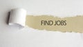 Find jobs. text on brown paper under a torn white paper sheet, business concept