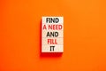 Find a need and fill it symbol. Concept words Find a need and fill it on wooden blocks on a beautiful orange table orange