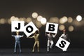Find and searching jobs due to economic depression crisis concept ,Miniature figures workers rise up and showing jobs wording with