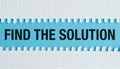 Find The Solution text on a blue background with torn notepad paper Royalty Free Stock Photo