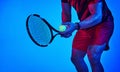 Find something youre good at and stick to it. Blue filtered shot of an unrecognizable tennis player getting ready to Royalty Free Stock Photo