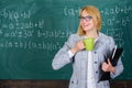 Find time to relax and stay positive. Keep positive attitude to work. Woman with tea cup and document folder chalkboard