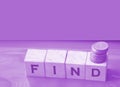 Find word Word Written In Wooden Cubes and coins. Business concept