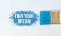 Find Your Dream text on blue paint with brush on white background. Royalty Free Stock Photo