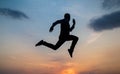 Find your freedom. personal achievement goal. man silhouette jump on sky background. confident businessman running