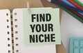 Find Your Niche word in notebook on the desk Royalty Free Stock Photo
